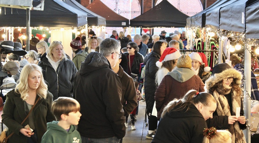 wide shot of shoppers at the youth market held in Birkenhead December 2025