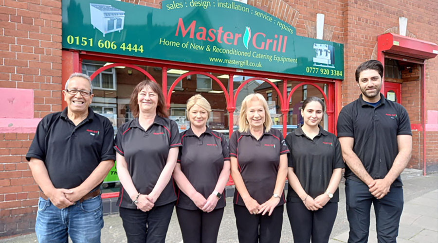 Staff lined up outside Master Grill in Wallasey