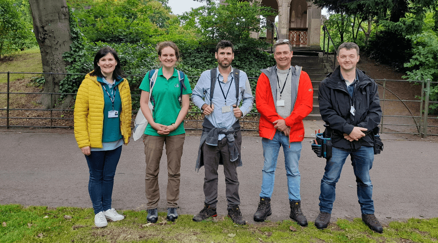 Five people facing the camera, with Birkenhead Park in the background. The people are the team that are conducting the plot surveys.