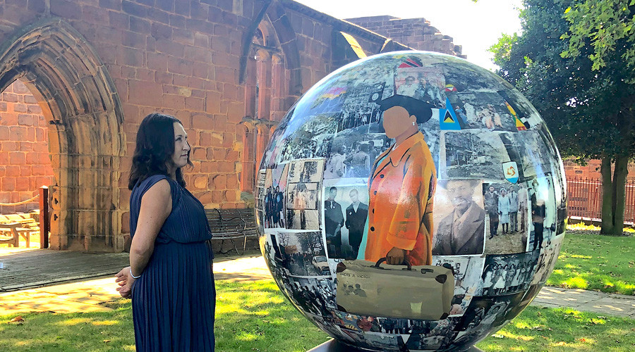 Wirral Council Leader Janette Williamson studies the globe.