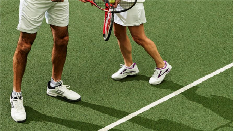 A game of mixed doubles tennis