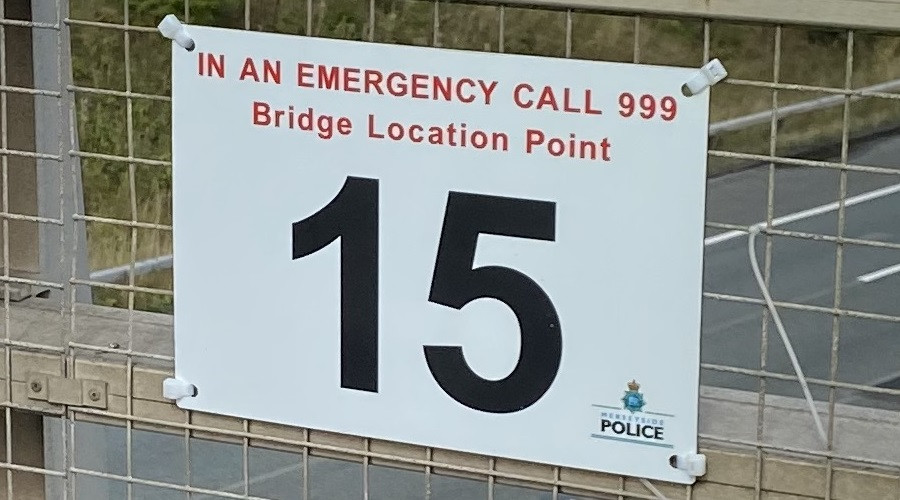 New location signage on motorway bridge