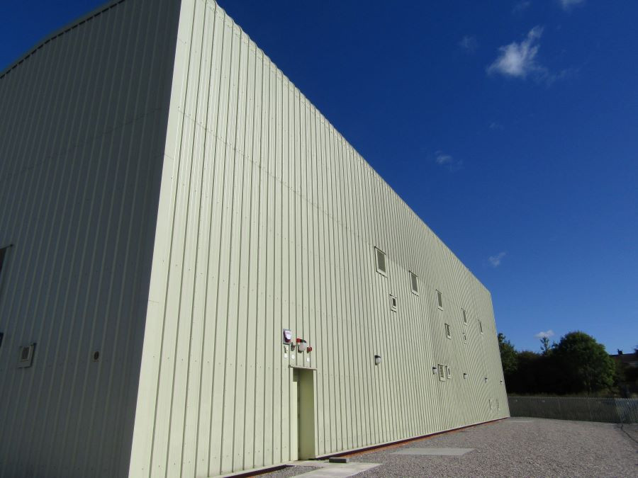 The exterior of Birkenhead Substation - a large square grey building