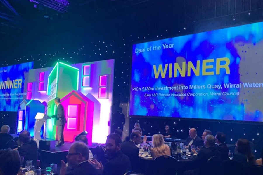 iImage of Insider Awards awards ceremony with big screen showing Millers Quay as the winner
