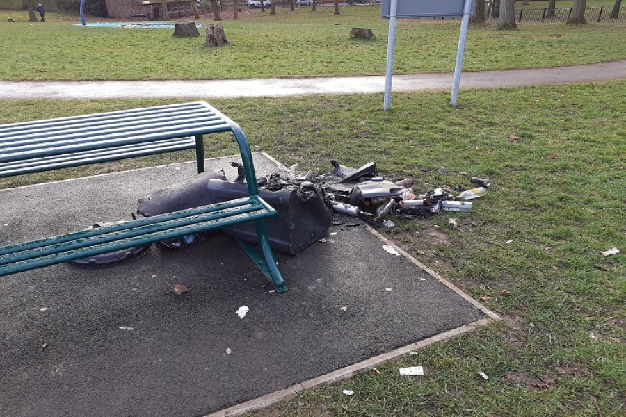 burned rubbish and debris next to a picnic table in Victoria Park platy area