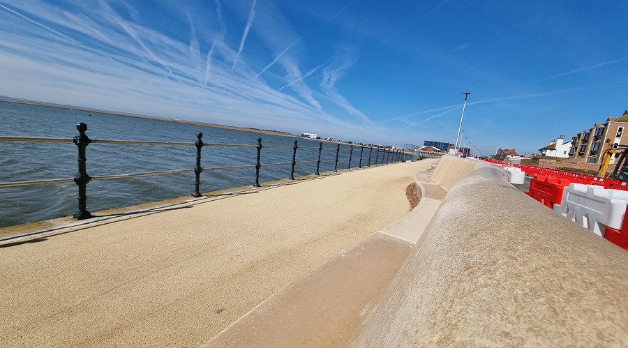 West Kirby promenade and seated flood wall looking over the marine lake
