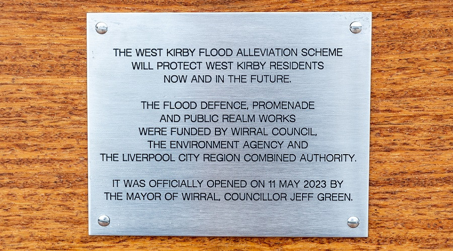 The plaque officially marking the construction of the flood wall at West Kirby