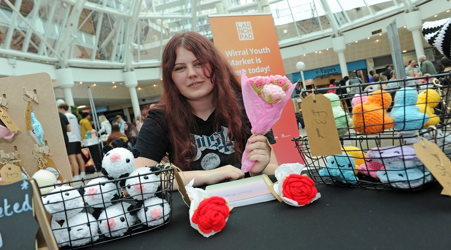 young entrepreneur with crochet goods