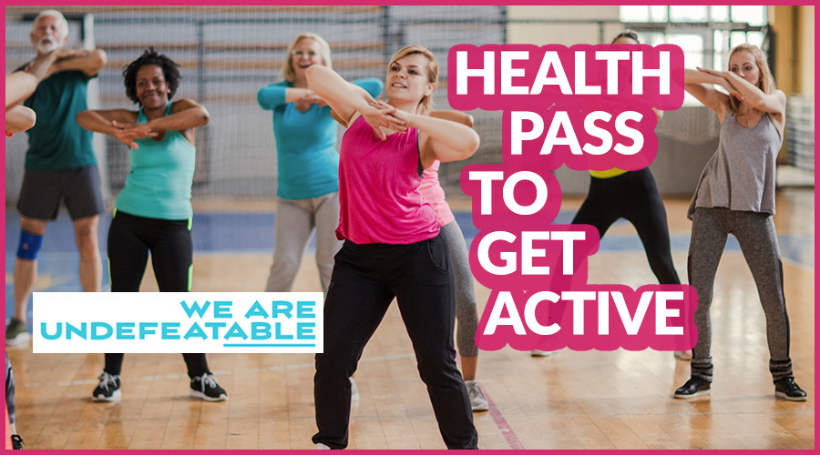 a group of people of different ages in a dance class, the words 'health pass to get active'