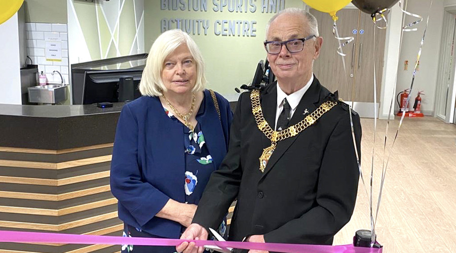 Picture of the Mayor and Mayoress of Wirral cutting a ribbon at Bidston site