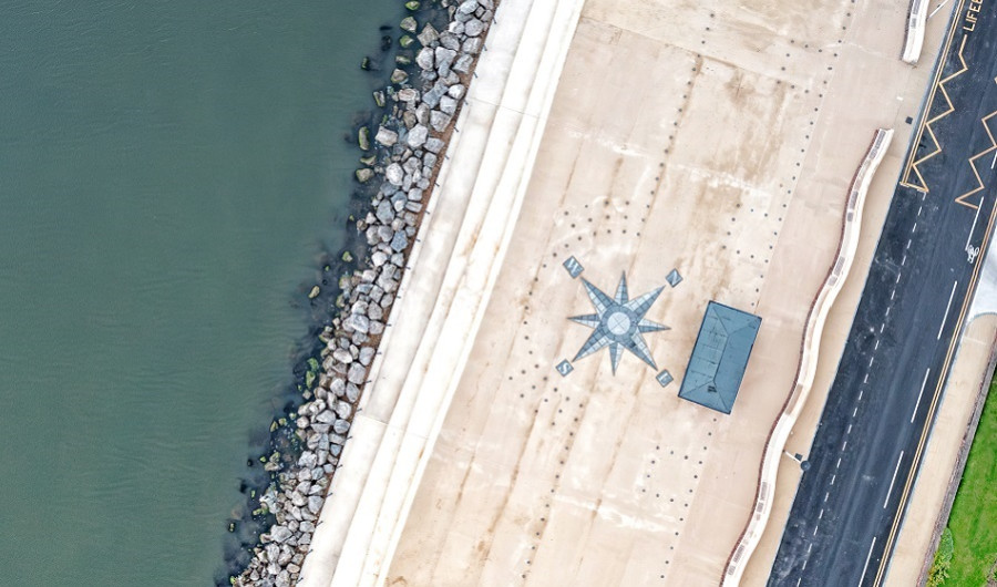 Aerial photo of West Kirby promenade with compass detail on floor