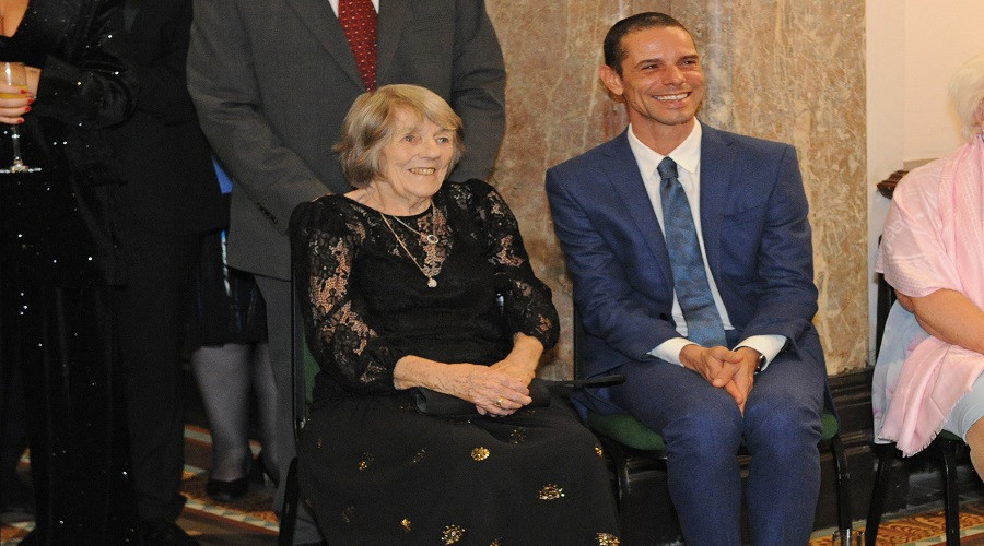 Photo of Paul's Sister Sheila and Husband Andre enjoying the singing.