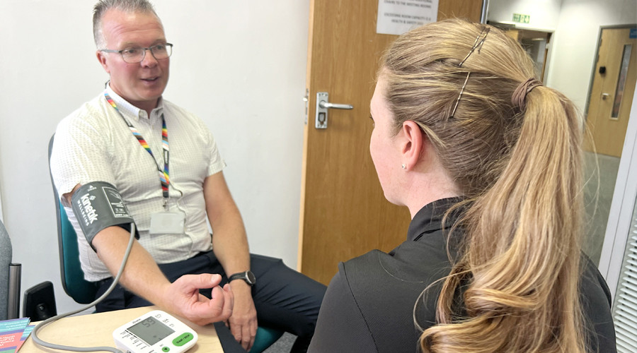 Dave Bradburn, Director of Wirral Public Health, getting his blood pressure checked