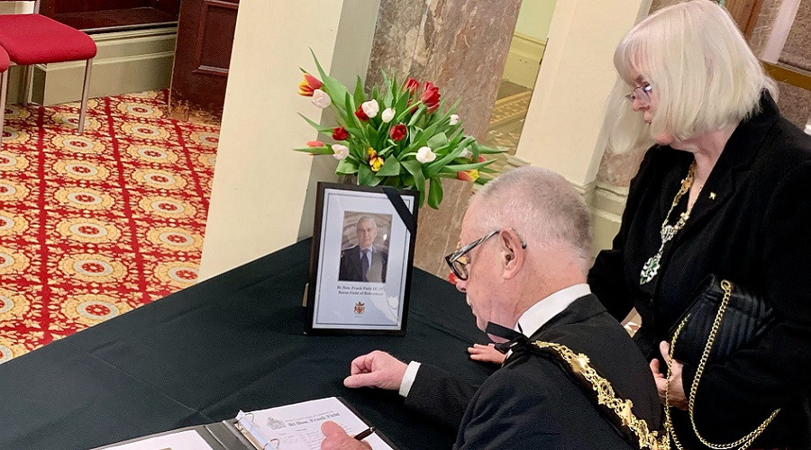 Wirral's Mayor and Mayoress signing the Book of Condolence opened in tribute to Frank Field