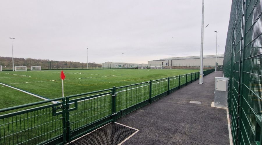 Side view of a football pitch on an overcast day.