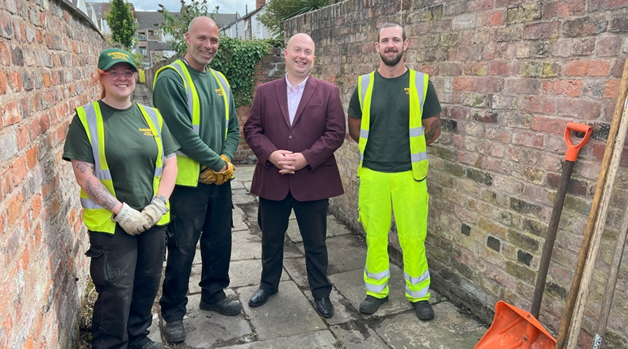 Cllr Paul Stuart visits the team responsible for clearing alleyways in Seacombe