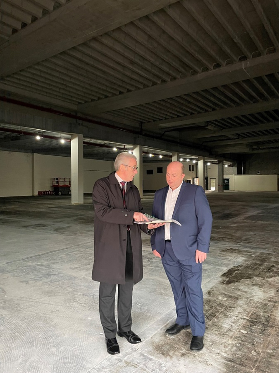 Leader of Wirral Council Paul Stuart and Andy Kehoe, Interim Assistant Director Property and Investment looking at plans in the newly stripped Birkenhead Market site