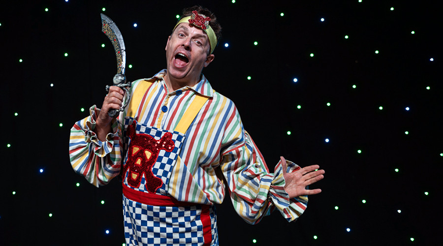 Photo of Sean Jones in his Smee costume holding a sword