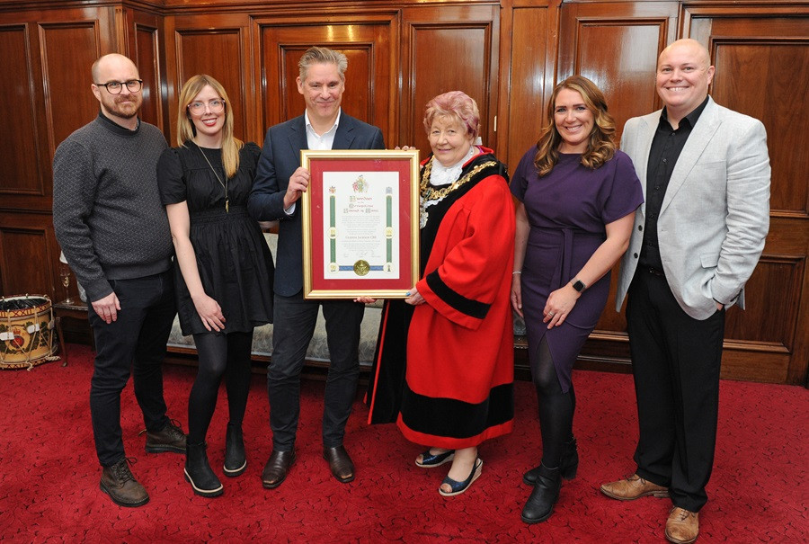 Mayor of Wirral presenting freedom of the borough to Glenda Jackson's family