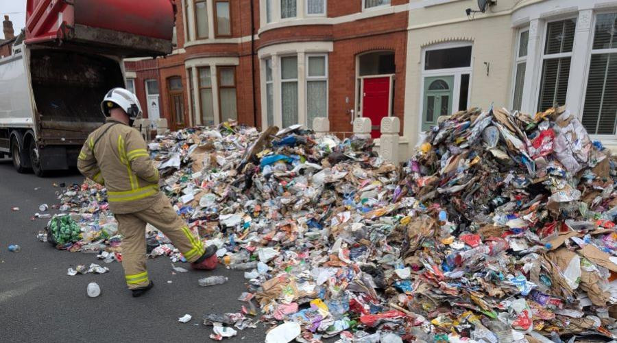 Recycling on road following bin wagon fire