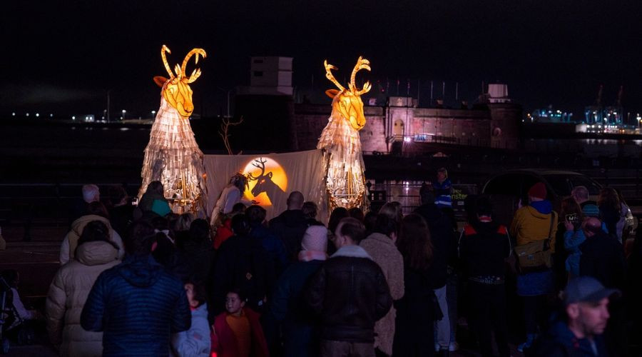 Photo of a shadow puppet show with the Caribou on the Promenade