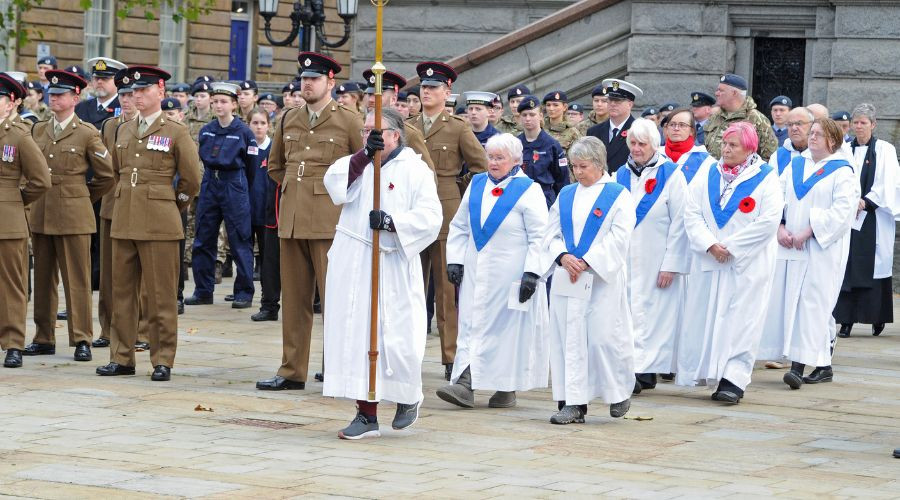 Photo of a group of clergy entering the parade area