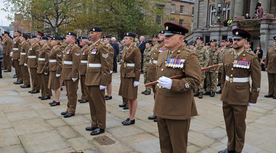 Photo of a line of soldiers standing to attention