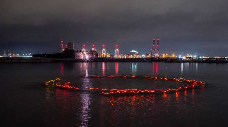 Photo of outdoor swimmers from Friends of New Brighton Marine Lake swimming in a large circle