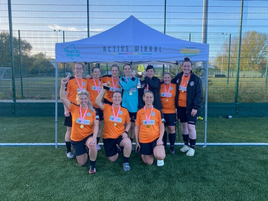 Winning football team smiling with medals