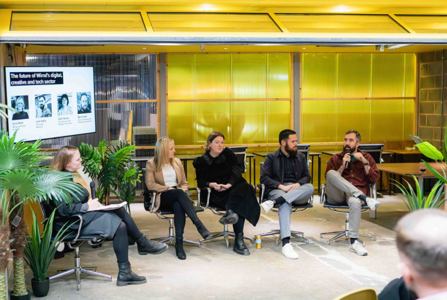 Image of an Accelerate Wirral panel discussion, featuring panel members sitting on chairs