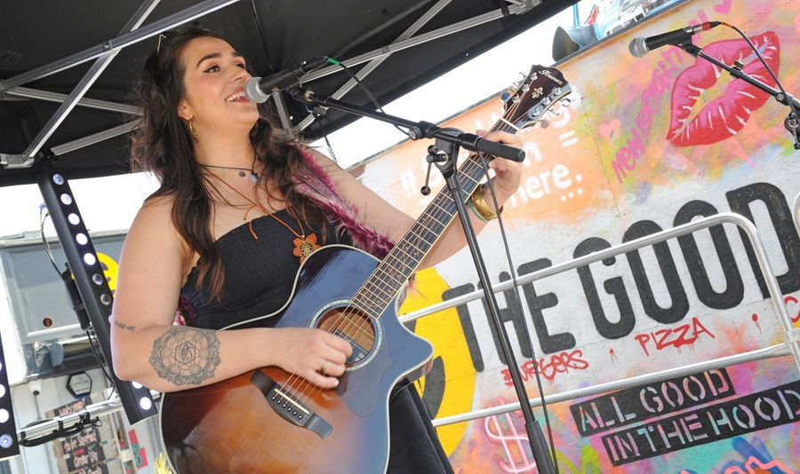 A singer performs on stage at a previous Youth Market event 