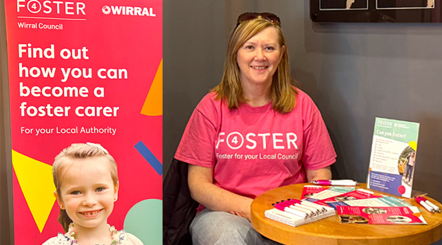 Jacqui from Foster4 sitting behind a table with foster4 merchandise next to a pull up foster 4 banner