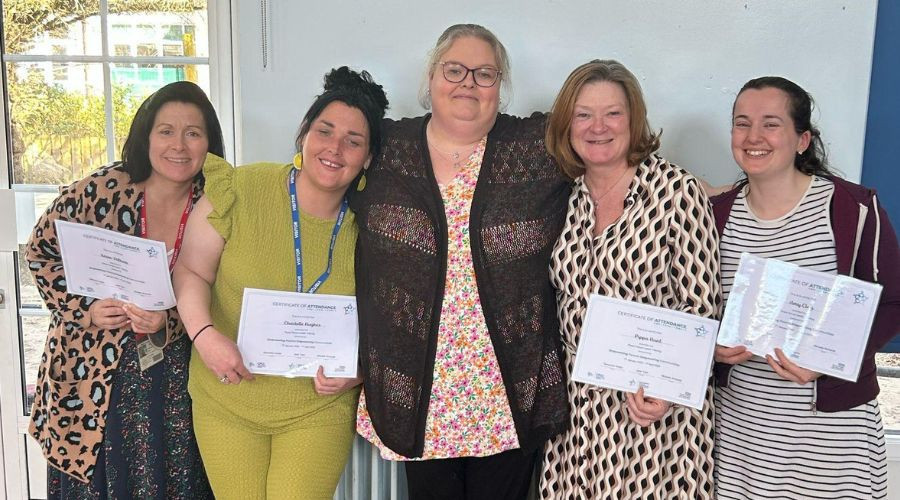 5 women Parent Group Leaders holding certificates