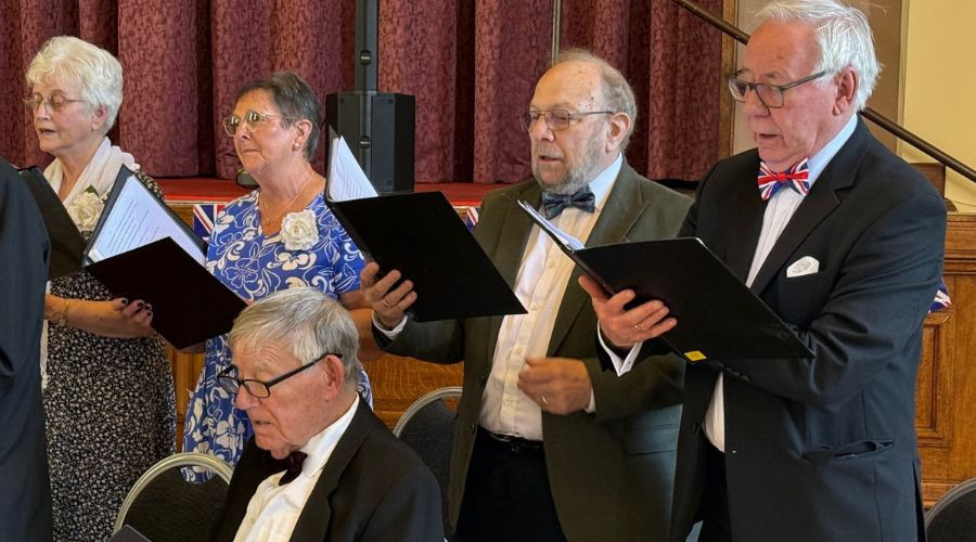 photo of singers in formal dress