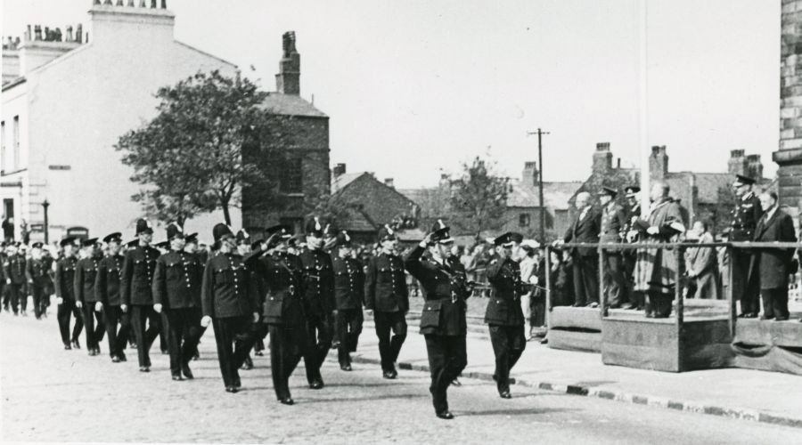 Photo of the Mayor taking the salute in front of Wallasey Town Hall at the Victory Parade in Seacombe on 19 May 1945