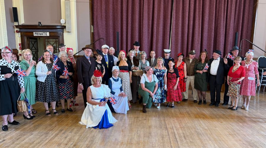 Photo of tea dance revelers in 1940s dress