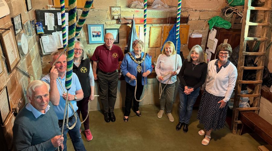 photo of bell ringers in a church tower