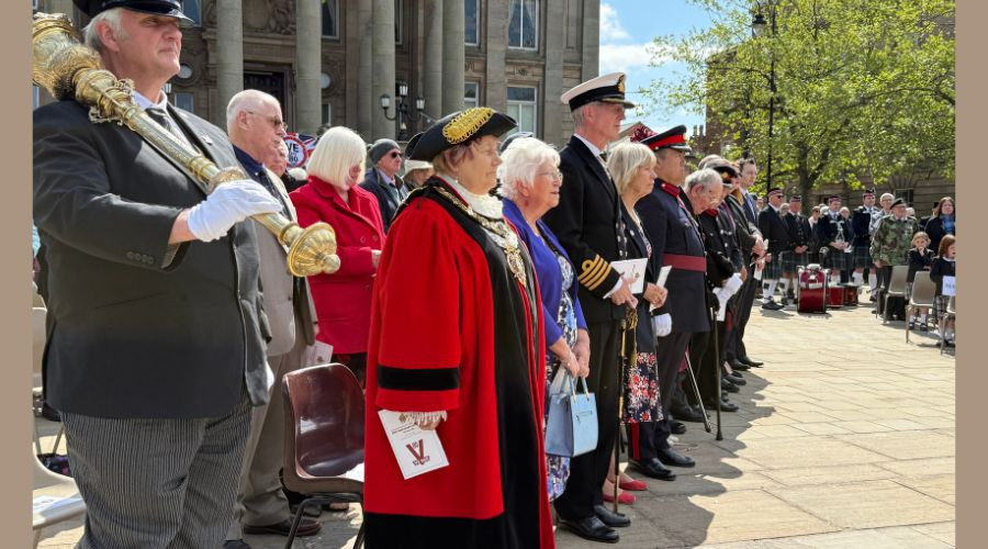Photo of dignitaries standing during the civic service in Hamilton Square