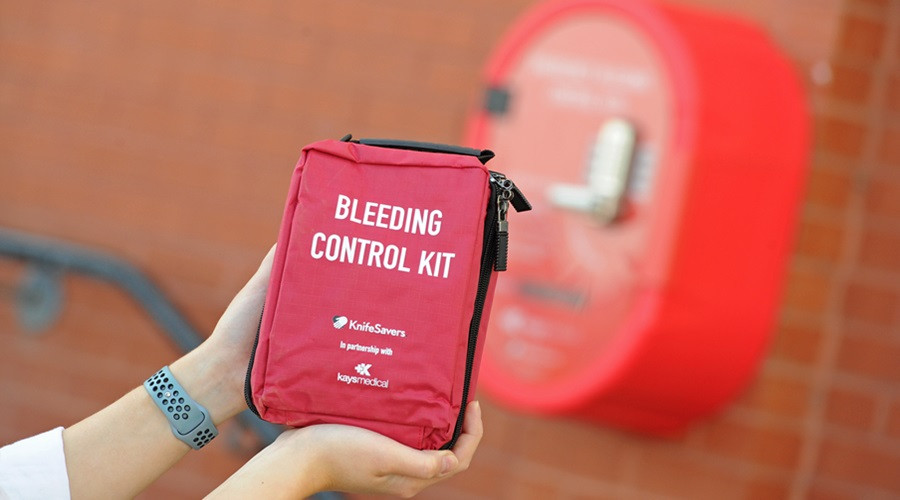 A bleed control in focus with a red cabinet in the background