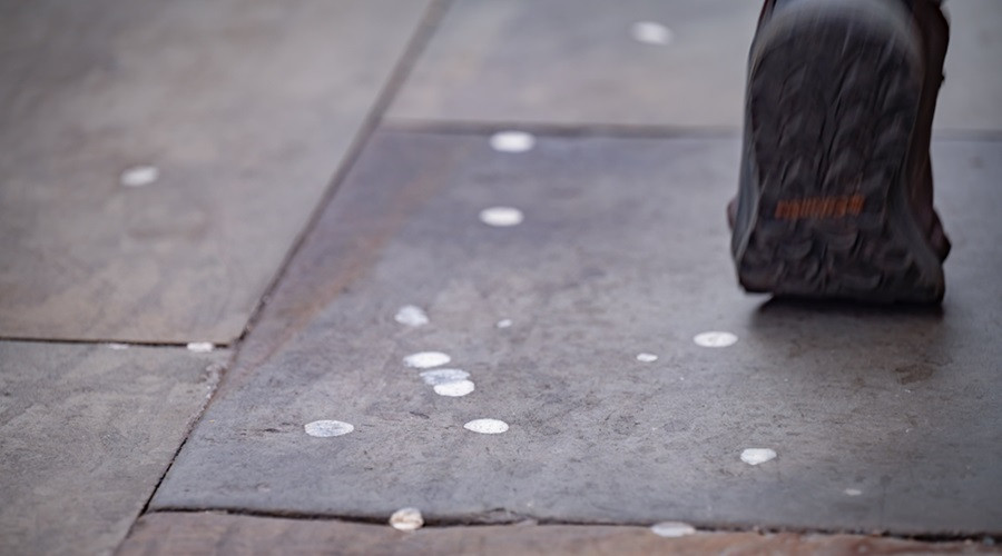 Stock image of dried chewing gum on a pavement