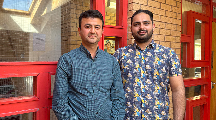 Picture of two men smiling to camera