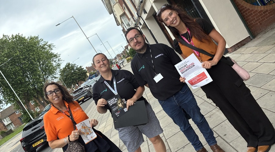 Photo showing partners taking part in an ASB Awareness Week event
