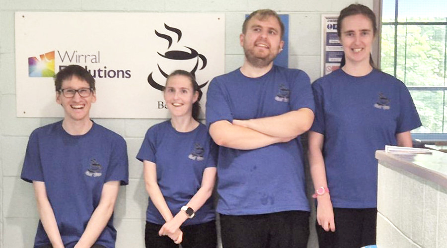 Four young people wearing purple bestbites tshirts smiling