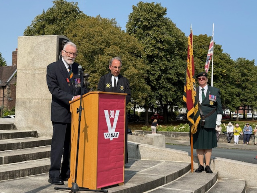 Photo of a speaker at the memorial service