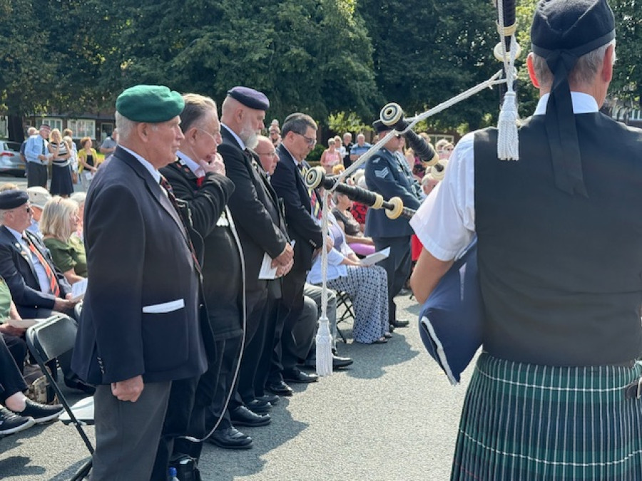 Photo of Veterans paying their respects at the service
