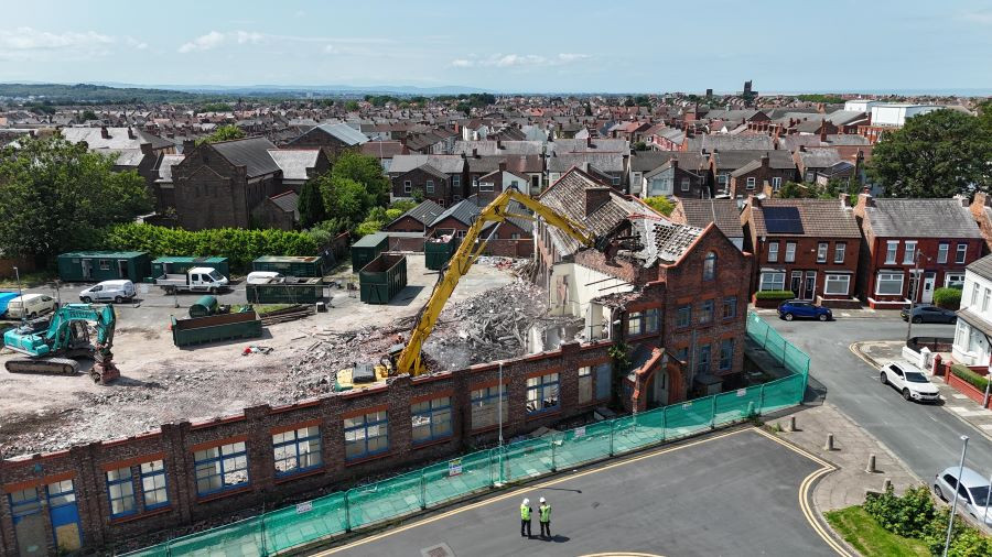 A photo showing a digger demolishing the building on Seaview Road mid demolition 