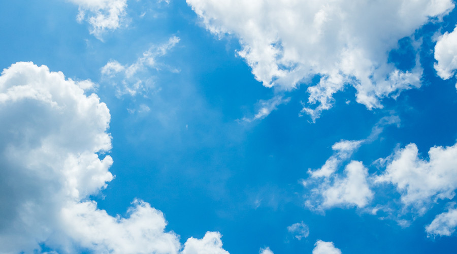 A generic image of a beautiful blue sky with fluffy white clouds