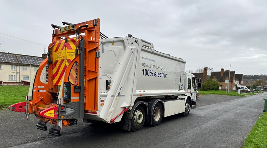 The electric-powered bin lorry being trialled is pictured in action in Woodchurch