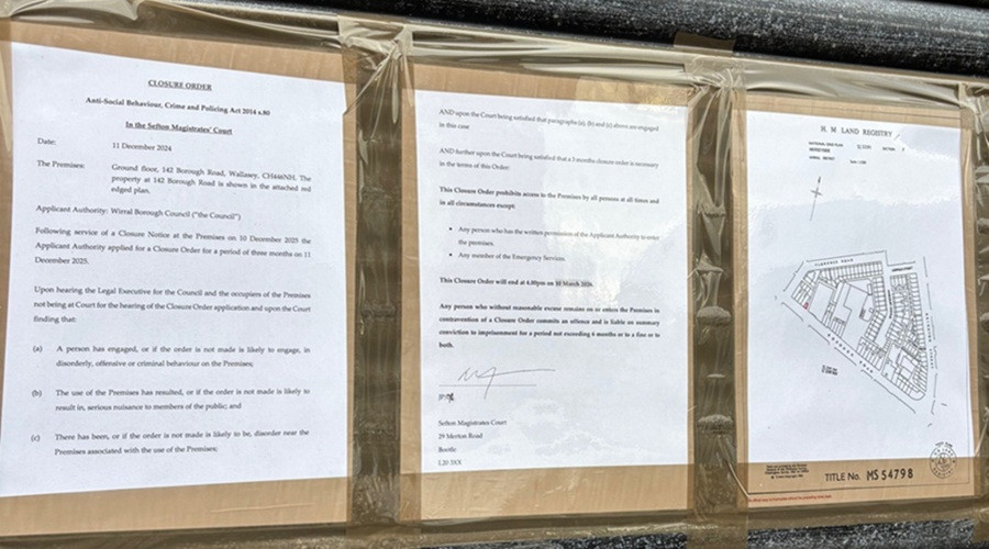A photo showing the legal Closure Order pinned to the frontage of the UK Mini Market shop