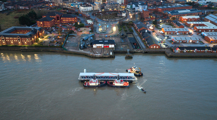 Aerial view of landing stage being put in place at Woodside